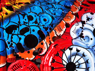 Colorful oil paint on a part machine closeup.