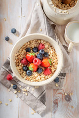 Delicious oat flakes with berry fruits as healthy meal