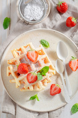 Homemade wafers with sweet strawberries and mint