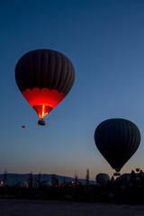 Hot air balloon flying over spectacular Cappadocia