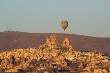 Hot air balloon flying over spectacular Cappadocia