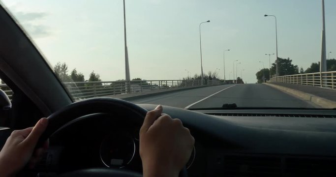 pretty young girl driving a car