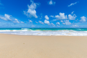 Fototapeta na wymiar Soft blue wave tropical sea beach sunny sky