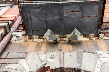  Two loudspeakers on the wall of an old building. City Alert System