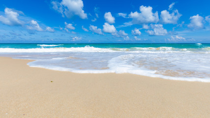 Fototapeta na wymiar Soft blue wave tropical sea beach sunny sky