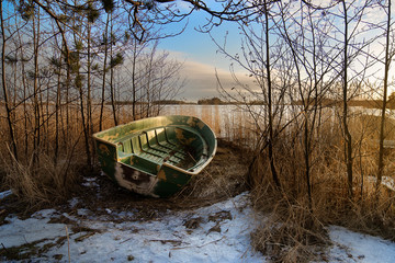 Small boat at a shore during winter