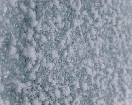 A snow and ice covered window