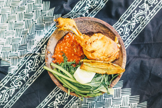 Nasi Tempong or Sego Tempong, traditional spicy culinary food of Banyuwangi, East Java, Indonesia. Similar with pecel but more spicy. mixed from rice, sambal chilli, vegetable, tofu, tempeh, and side 
