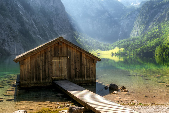 Morning sunrise view in bavaria national park berchtesgaden land, germany, landscape hiking vacation travel at the obersee with fisher hut