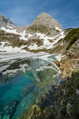 Winter spring lake, blue clear water near Seebensee, Drachensee, Coburger Hut Hütte, Austria, Lermoos, near fernpaß, ehrwald, spring, snow, summer, hiking, alps, mountain