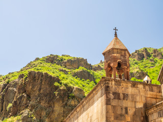 Ancient belfry with traditional Christian cross at the top