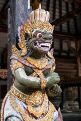 Balinese sculpture green and gold.