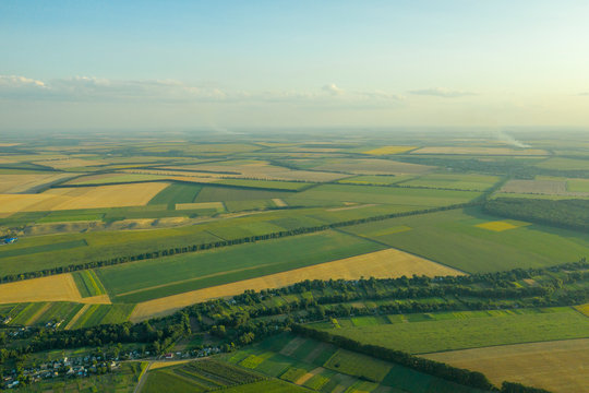 Geometric figures in the fields of the farm in the village from the height of the bird's eye. Kvadrokopter pictures