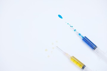 Medical syringe isolated and syringes with colored liquid on white background