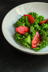 leaves mix salad, tomato, salad dressing, Healthy salad (mix micro greens, juicy snack). food background - Image