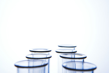 Empty medical glass test tubes on white