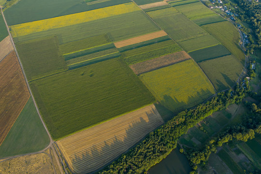 Geometric figures in the fields of the farm in the village from the height of the bird's eye. Kvadrokopter pictures