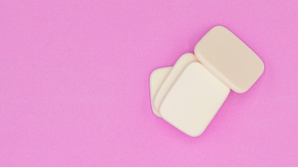 Cosmetic sponges powder for face make up on, Cosmetic sponges on pink background,