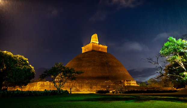 Stupa Jetavanaramaya in beams of night illumination.