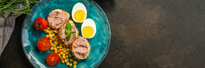Breakfast snack, tasty food (pate, toast, tomato, corn, egg, coffee). top view. food background