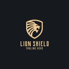 Gold lion head with shield logo vector design template in isolated black background