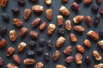 Dates are scattered on the black table