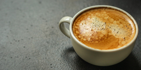 coffee freshly brewed in a white cup serving of beverage (coffee grain). food. top. copy space