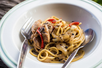 Homemade spaghetti with pork and spicy herb