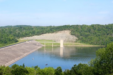 A hilltop view of the lake and the dam in the park.