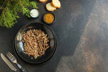 buckwheat porridge with mushrooms. food background. top view. copy space
