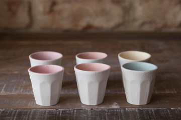 making objects with clay and tools. close up cropped photo about ceramics.