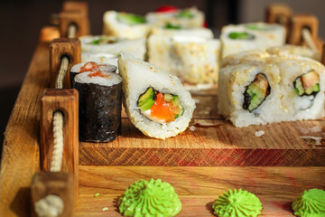Sushi maki rolls (tuna, salmon, shrimp, avocado and other ingredients). japanese food. Top view, assorted sushi, menu. copy space