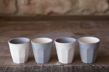 making objects with clay and tools. close up cropped photo about ceramics.