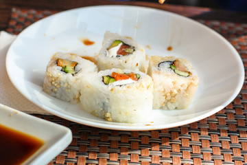 Sushi maki rolls (tuna, salmon, shrimp, avocado and other ingredients). japanese food. Top view, assorted sushi, menu. copy space