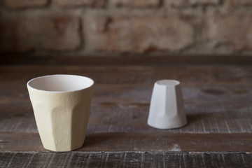 making objects with clay and tools. close up cropped photo about ceramics.