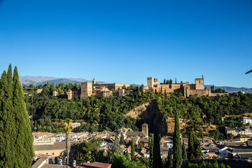 Fototapeta premium Views of the Alhambra from the terrace of a beautiful bar. Pomegranate