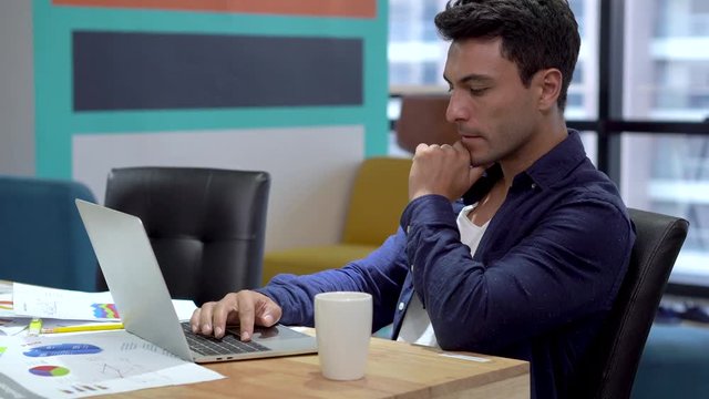 Business man working and  typing on laptop keyboard  in the  modern office .  busy . looking on notebook cumputer. serious