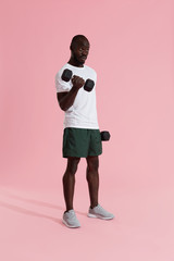 Exercise. Sports man doing dumbbell biceps workout training