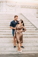 Happy couple at sunset in Italy. Evening summer photo shoot in Rome.