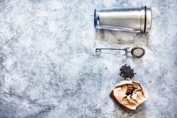 Metal thermos and tea infuser.Eco friendly Zero waste plastic free kitchen on gray  background. concept sustainable lifestyle or Recycling and ecology.