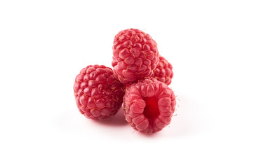 Four red raspberry berries isolated on white background.