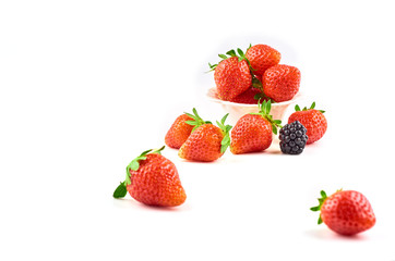 Composition of strawberries, blackberries, blueberries, raspberries and red currants on a white background.
