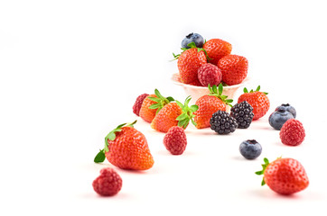 Fototapeta na wymiar Composition of strawberries, blackberries, blueberries, raspberries and red currants on a white background.