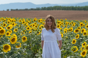 Woman in a sunflower field, Provence, France