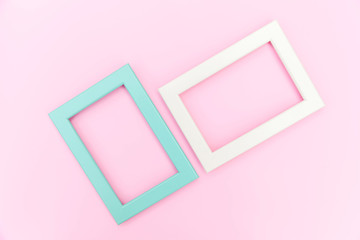 Simply design with empty pink and blue frame isolated on pink pastel colorful background. Top view, flat lay, copy space, mock up. Minimal concept