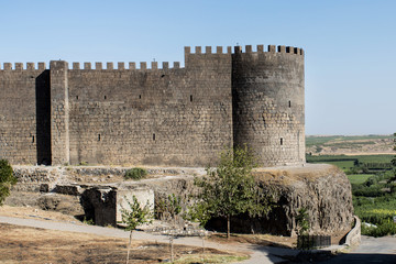 Black basalt wall of fortress fortifications with battlements in the city jf Dyarbakir, the capital...
