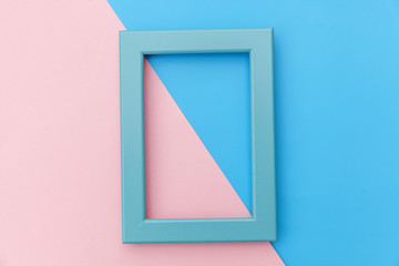 Simply design with empty blue frame isolated on pink and blue pastel colorful background. Top view, flat lay, copy space, mock up. Minimal concept