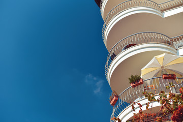 exterior of hotel on sea resort with circle balconies