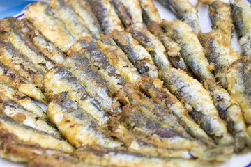 Pan-fried anchovy fish dish. Stock photo.