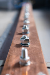 Electric copper bus bars, bolting the live parts of the transformer